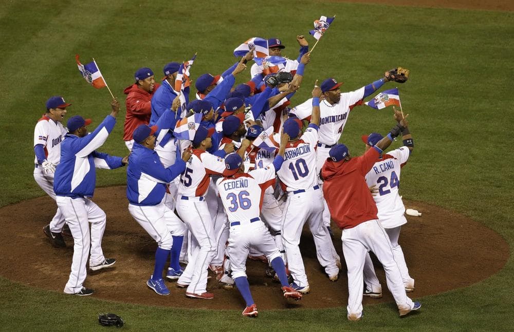 The Dominican Republic players celebrate after beating Puerto Rico in the championship game of the World Baseball Classic in San Francisco Tuesday. The Dominican Republic won 3-0. (Jeff Chiu/AP)