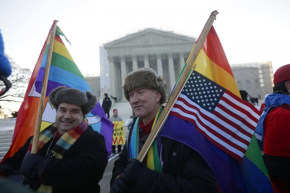 Marcus, left, and Daniel  German-Dominguez stand outside the Supreme Court in Washington, Tuesday, March 26, 2013, before the court's hearing on Californias voter approved ban on same-sex marriage. (AP Photo/Pablo Martinez Monsivais)