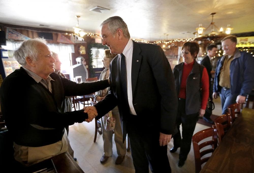 Republican hopeful for the U.S. Senate former U.S. Attorney Michael Sullivan, center, greets Fred Underhill, of Rochester, Mass., left, as he arrives before the Rochester Republican Town Committee Meeting at the Ponderosa Sportsman's Club, in Acushnet, Mass., Sunday, March 24, 2013. (AP Photo/Steven Senne)