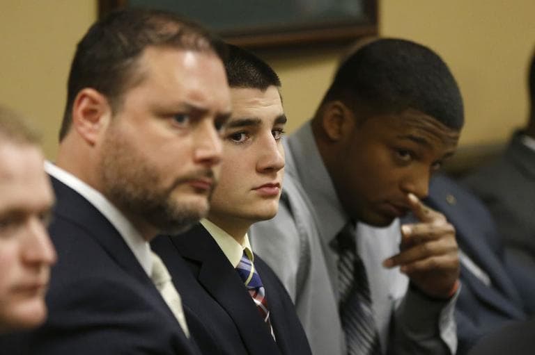 From left, Defense attorney Adam Nemann, his client, defendant Trent Mays, 17, and defendant 16-year-old Ma'lik Richmond are seen as they await a new witness during Mays and Richmond's trial on rape charges in juvenile court on Wednesday, March 13, 2013 in Steubenville, Ohio. (AP)