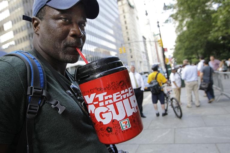  In this July 9, 2012 file photo, protester Eric Moore sips on an extra-large beverage during a protest against Mayor Michael Bloomberg's proposal to prohibit licensed food establishments from using containers larger than 16 ounces to serve high-calorie drinks at City Hall in New York. (AP)