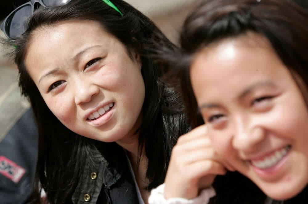Jessica Peng, left, and Lauren Sit talk about proposed college admissions guidelines affecting Asian students at Lowell High School in San Francisco, Thursday, April 23, 2009. (AP)