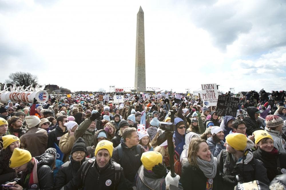 Thousands of protestors gather at the National Mall in Washington calling on President Barack Obama to reject the Keystone XL oil pipeline from Canada, as well as act to limit carbon pollution from power plants and “move beyond” coal and natural gas, Sunday, Feb. 17, 2013. (AP)