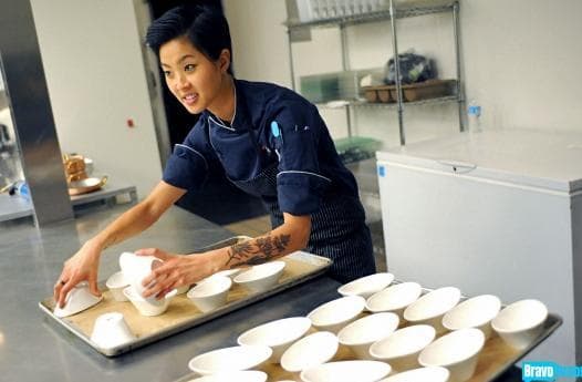 Kristen Kish starts plating one of her dishes on the show Top Chef. (Bravo)