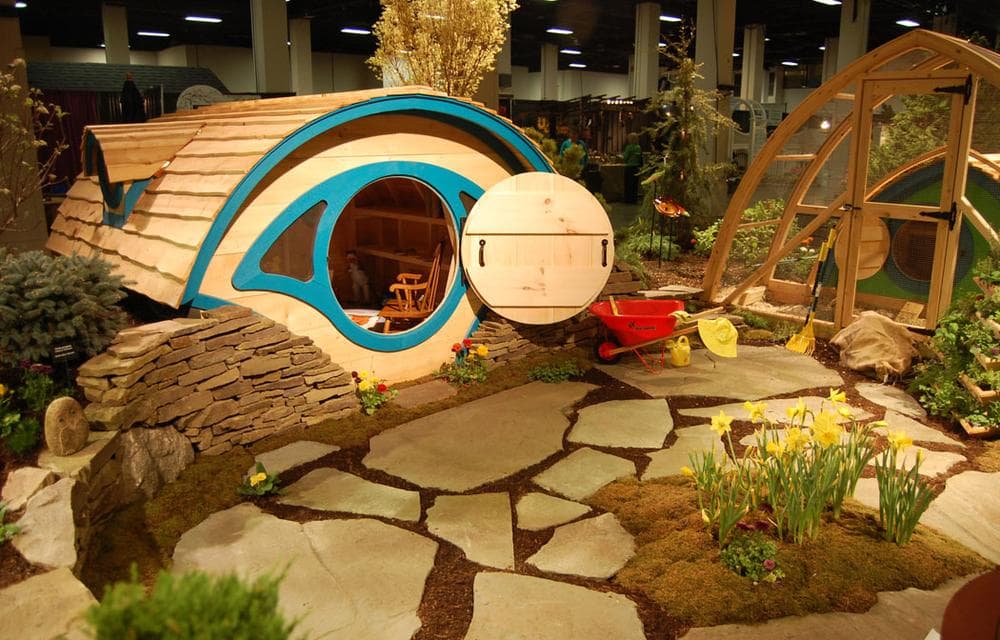 New England Nurseries of Bedford proposes inspiring love of the outdoors and gardening among children by placing this eye-shaped playhouse near a garden and chicken coop. (Greg Cook)