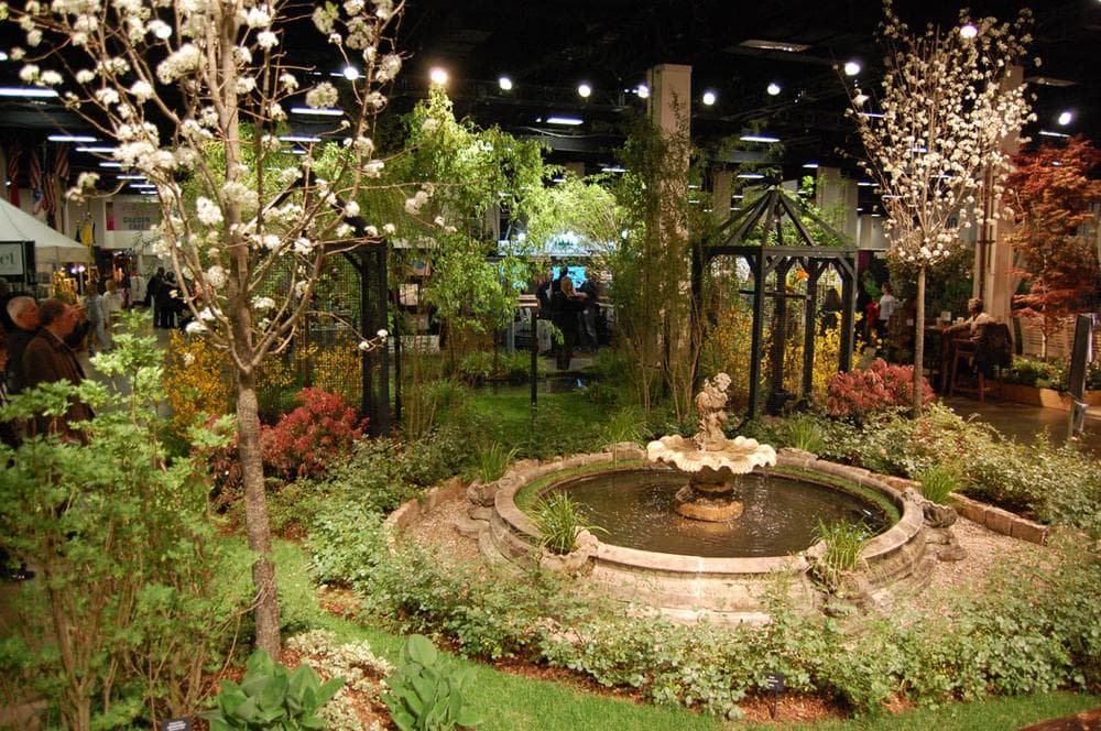 Horticulturalist Peter Sadeck of Lakeville designed this garden featuring a fountain and live parrots. (Greg Cook)