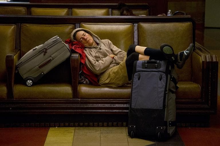 A traveler sleeps at Union Station in Los Angeles, Wednesday, Nov. 21, 2012.  (AP /Jae C. Hong)