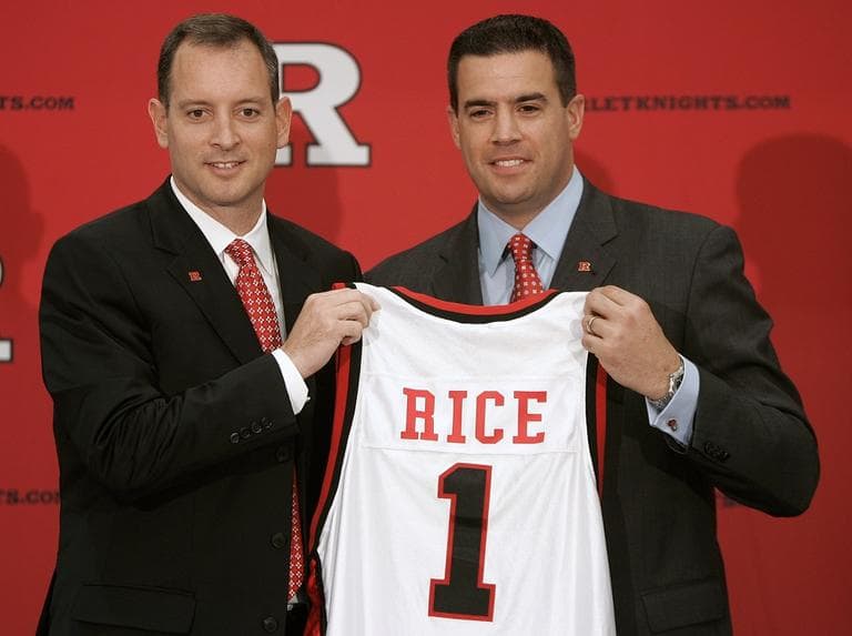 In this May 6, 2010, photo, Rutgers athletic director Tim Pernetti, right, presents Mike Rice with a jersey after Rice was introduced as the school's men's basketball coach during a news conference in Piscataway, N.J. (AP/Rich Schultz, File)