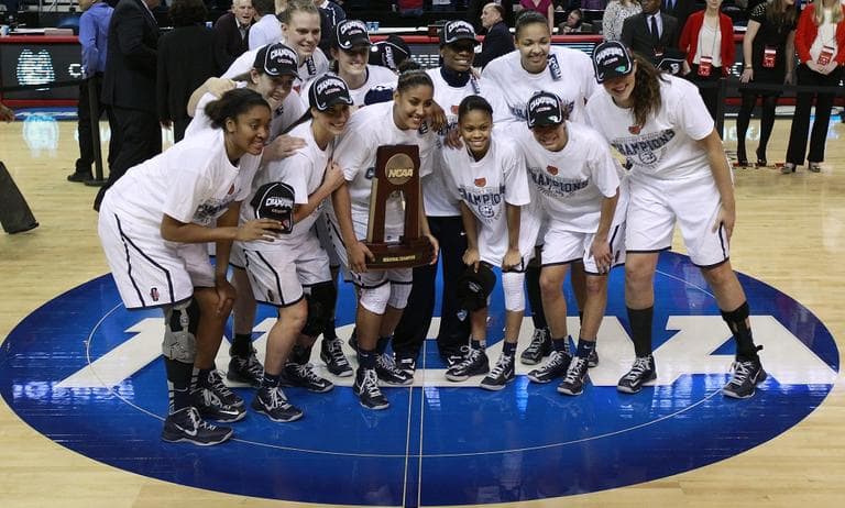 Connecticut players pose after beating Kentucky in the women's NCAA regional final basketball game in Bridgeport, Conn., Monday, April 1, 2013. Connecticut won 83-53 and advances to the Final Four. (AP/Charles Krupa)