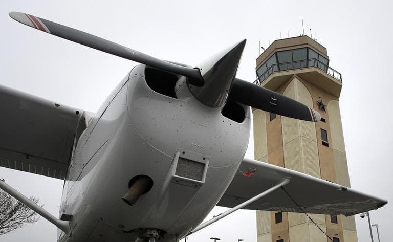 A Cessna aircraft is parked near by the air traffic control tower at the Collin County Regional Airport at McKinney Friday, March 22, 2013, in McKinney, Texas. The tower at Collin County Regional Airport in McKinney is scheduled for closure. (AP/Tony Gutierrez)