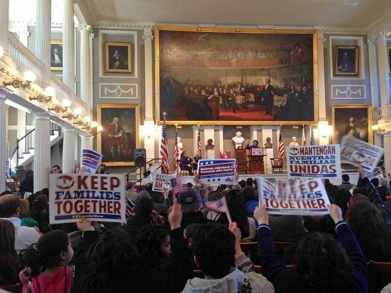 About 800 immigrants, community activists, representatives of workers’ groups and political leaders rallied at Faneuil Hall on Saturday for immigration reform. (Rachel Paiste/WBUR)