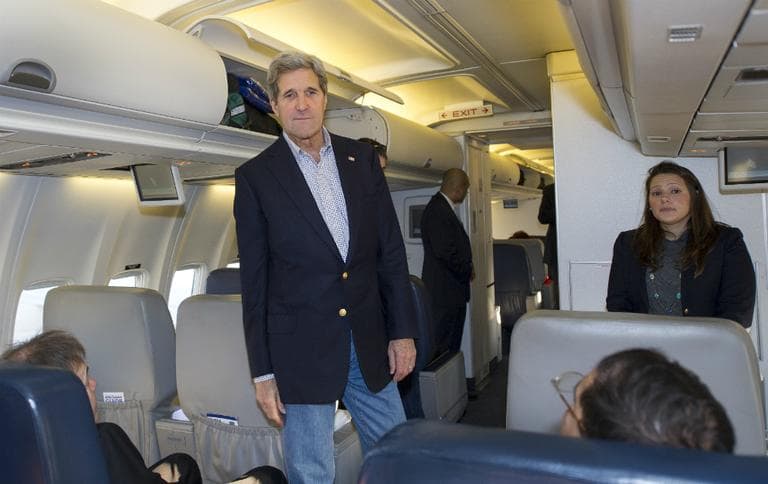 U.S. Secretary of State John Kerry talks to reporters traveling abroad with him, Saturday, April 6, 2013, at Andrews Air Force Base in Maryland. (Paul J. Richards/AP Pool)