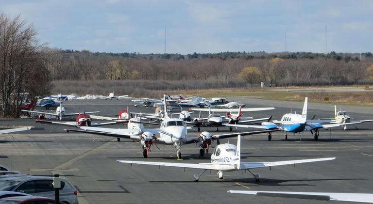 Planes gather at Norwood Memorial Airport, which is one of five municipal airports in Mass. that will shut down its air traffic control tower due to mandatory federal budget cuts. (Bruce Gellerman/WBUR)