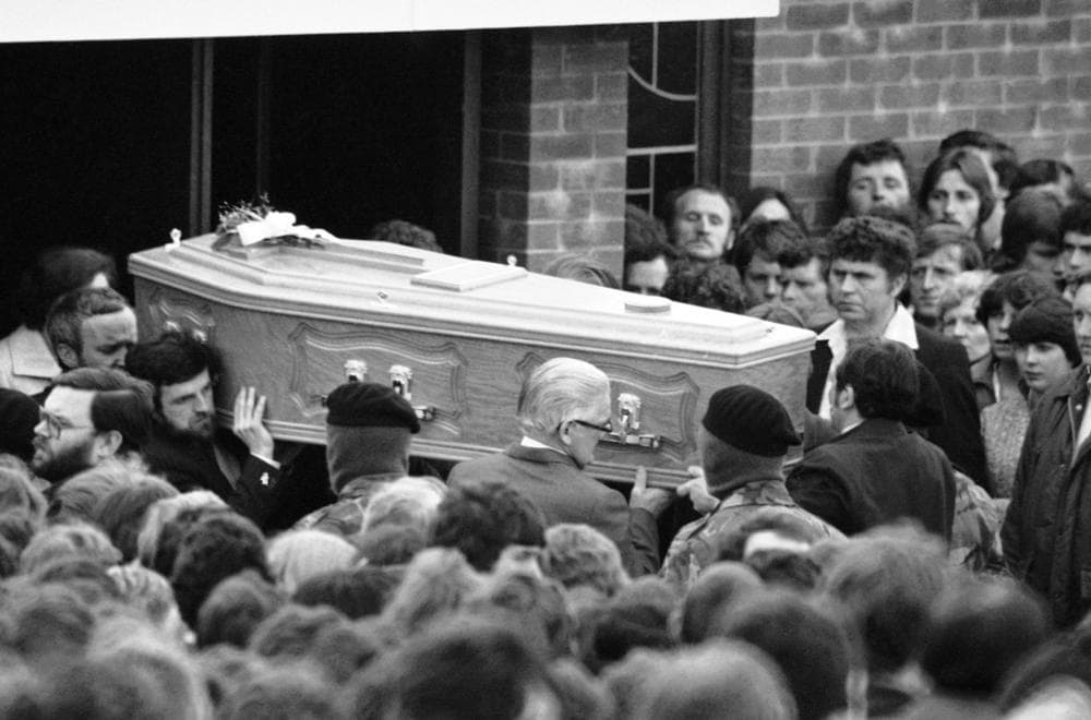 Escorted by masked IRA men, the coffin containing the body of hunger striker Bobby Sands leaves a church near his home in the Twinbrooks area of Belfast, Northern Ireland on May 7, 1981, en route to the citys Milltown cemetery. Sands died after 66 days on hunger strike. (Peter Kemp/AP)