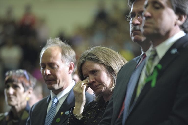 Families of children killed in the Newtown school shooting, including Mark, second from left, and Jackie Barden, parents of 7-year-old Daniel; William Sherlach, second from right, husband of Mary, the Sandy Hook Elementary School psychologist; and Neil Heslin, right, father of 6-year-old Jesse, listen as President Barack Obama speaks at the University of Hartford in Hartford, Conn., Monday, April 8, 2013. (Susan Walsh/AP)