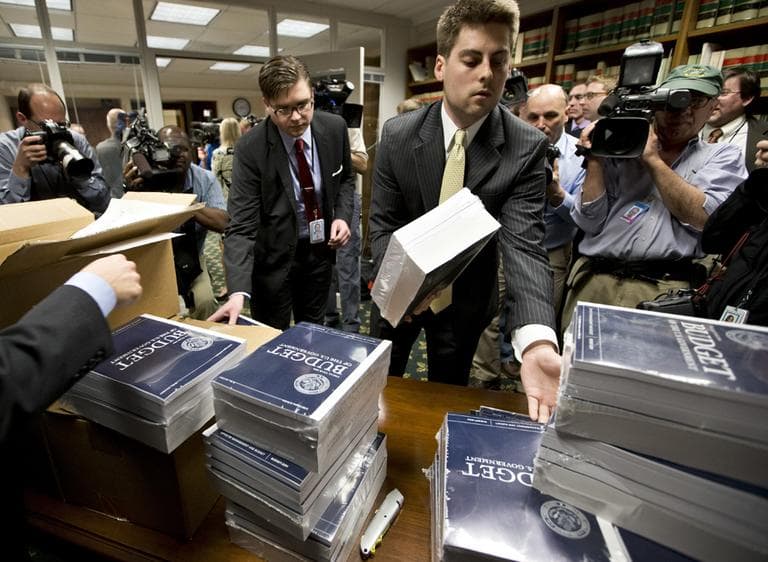 Copies of President Barack Obama's budget plan for fiscal year 2014 are distributed to Senate staff on Capitol Hill in Washington, Wednesday, April 10, 2013. (J. Scott Applewhite/AP)