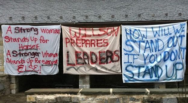 Signs hang at Wilson College, protesting the decision to make the school co-ed. (change.org)