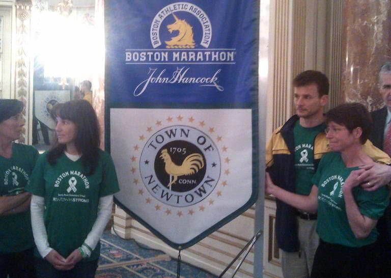A group of parents from Newtown, Conn. are running the marathon in memory of the 26 people killed in the mass shooting there in December. Laura Nowacki (far right) says &quot;We're all parents. We're Sandy Hook parents. We're also runners and we are here to run 26 miles for 26 lives.&quot; (Alex Ashlock/Here &amp; Now)