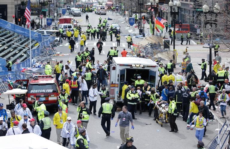 On the fire frequency, an unidentified Boston officer warned incoming ambulances about the chaos waiting them. “We have hysteria in the street,” he said. “All the streets are blocked with civilians. All companies use caution!” (Charles Krupa/AP)