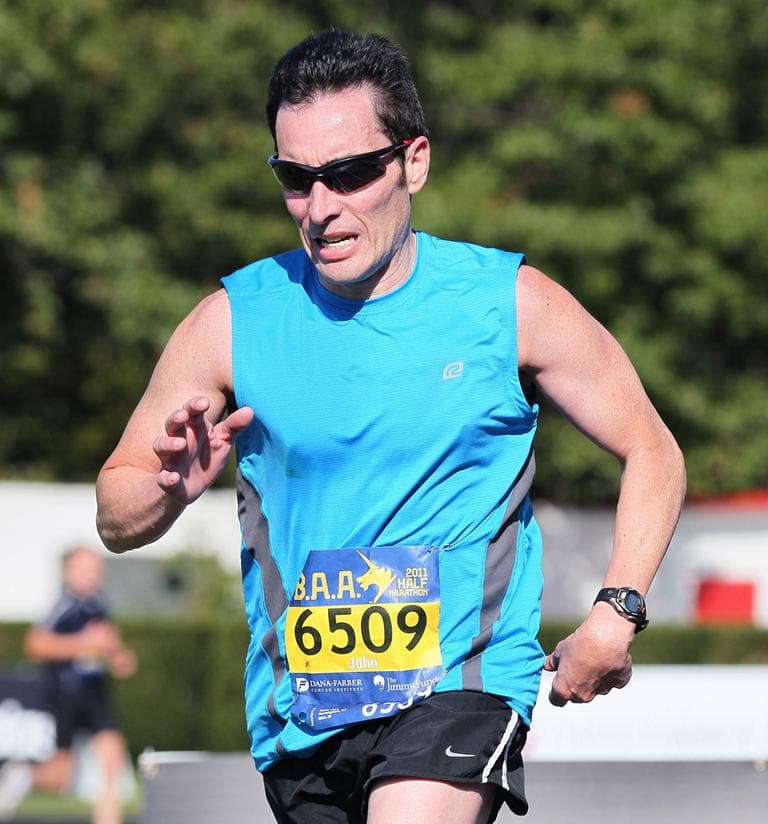 Author John Hanc is pictured finishing the 2011 B.A.A. Half Marathon. (Victah Sailer/PhotoRun)