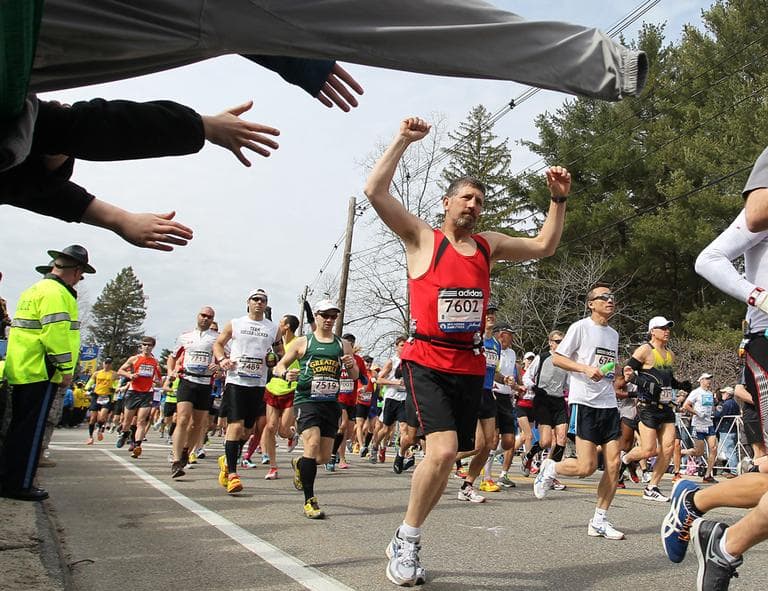 Chris Royer, from Coventry, Vt., raises his hands as he starts of the 117th running of the Boston Marathon, in Hopkinton, Mass., Monday, April 15, 2013. (Stew Milne/AP)