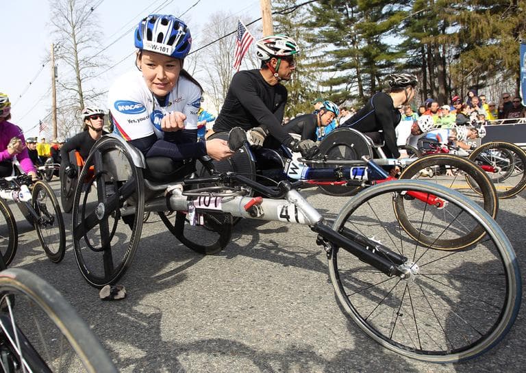 Defending champion Shirley Reilly, left, gets her wheelchair into position prior to the start of the wheelchair division of the 117th running of the Boston Marathon, in Hopkinton, Mass., Monday, April 15, 2013. (Stew Milne/AP)