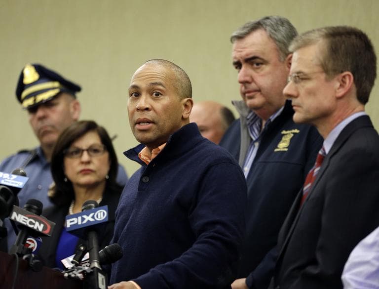 Massachusetts Gov. Deval Patrick speaks as Boston Police Commissioner Ed Davis, middle, and FBI Special Agent in Charge Richard DesLauriers, far right, listen at a news conference in Boston Monday, April 15, 2013 regarding two bombs which exploded in the street near the finish line of the Boston Marathon on Monday, killing three people and injuring more than 130. (Elise Amendola/AP)