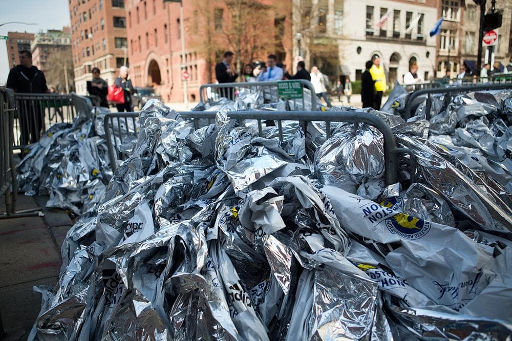Boston Marathon polyethylene heatsheets piled up at Exeter and Newbury Streets. (Jesse Costa/WBUR)