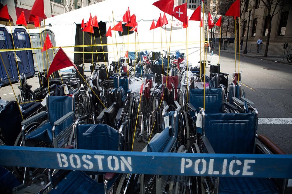 Wheelchairs corralled at the medical tent on St James St. (Jesse Costa/WBUR)