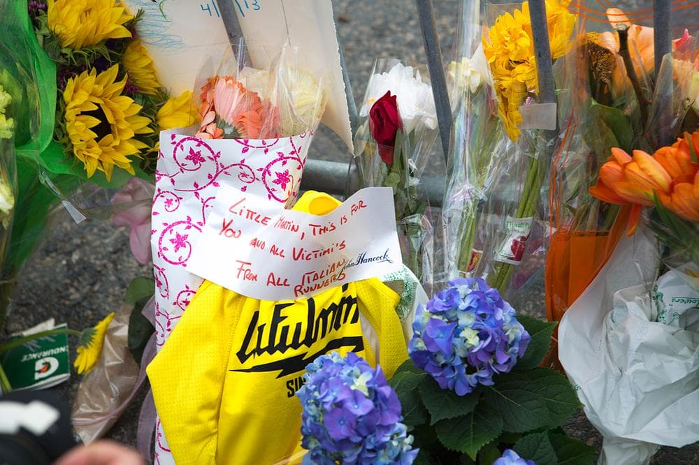 Close up of Memorial set up on Clarendon and Boylston Streets after police and opened the barricade at Berkley St. (Jesse Costa/WBUR)