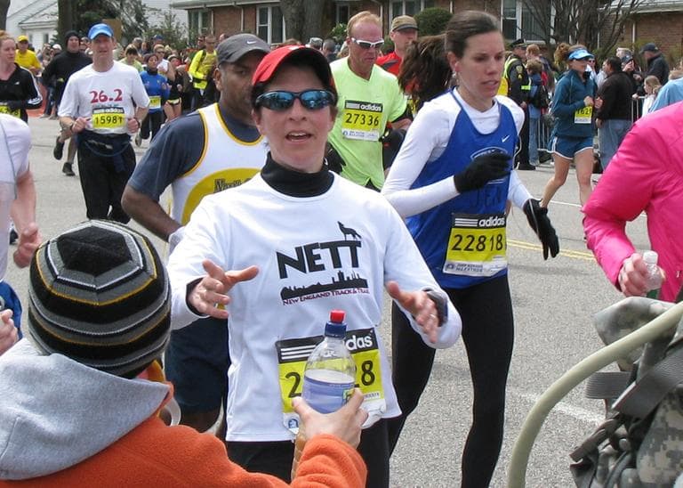 Karyn Miller-Medzon takes water from her son Noah at mile 17 of the Boston Marathon. (Medzon family photo)