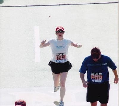 Karyn Miller-Medzon crosses the finish line at the Boston Marathon a few years ago. 