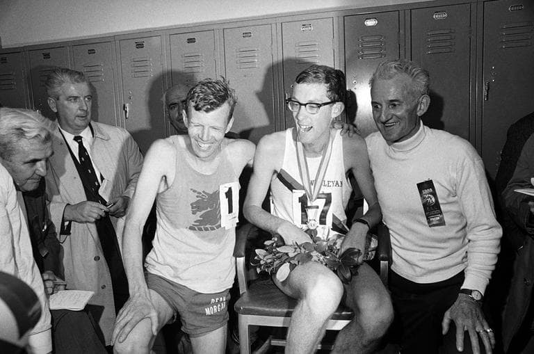 Ambrose Burfoot, center, a Wesleyan University senior from Groton, Ct., winner of the 72nd annual B.A.A. Marathon is congratulated by Johnny Kelley, left, also of Groton, after finishing 15th, and John Kelley, of Watertown, Mass., in the dressing room in Boston, April 19, 1968. (AP)