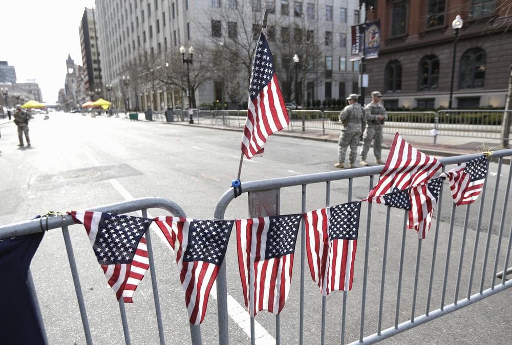Bill Littlefield reflects on Monday's trajedy at the Boston Marathon. (Julio Cortez/AP)