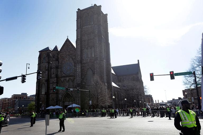 On Thursday, people gather ahead of an interfaith service at Cathedral of the Holy Cross, held in the wake of Monday's Boston Marathon explosions. (Matt Rourke/AP)