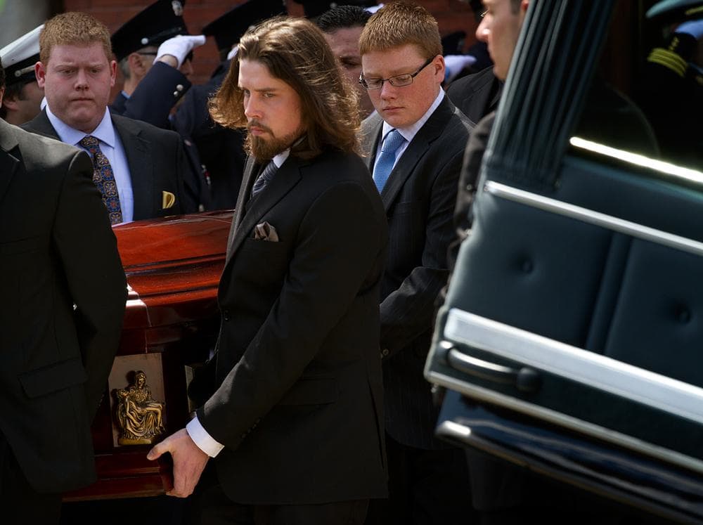 Pallbearers carry the casket of Krystle Campbell out of St. Joseph's Church. (Jesse Costa/WBUR)