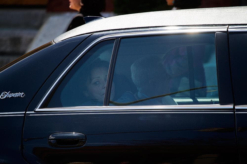 A grieving Patty Campbell, Krystal Campbell's mother, sits in the back a limousine en route to the burial. (Jesse Costa/WBUR)