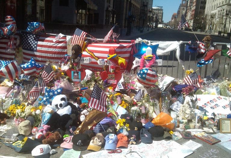 A makeshift memorial near the finish line of the Boston Marathon is pictured on Sunday, April 21. (Alex Ashlock/Here &amp; Now)