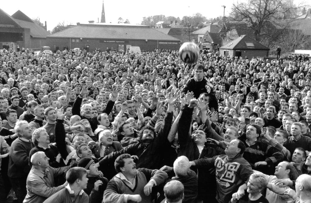 Each year, thousands of players compete in an annual game of Shrovetide Football. (Courtesy of Peter