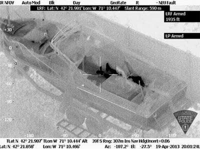 This Friday, April 19, 2013 image made available by the Massachusetts State Police shows 19-year-old Boston Marathon bombing suspect, Dzhokhar Tsarnaev, hiding inside a boat during a search for him in Watertown, Mass. (Massachusetts State Police/AP)