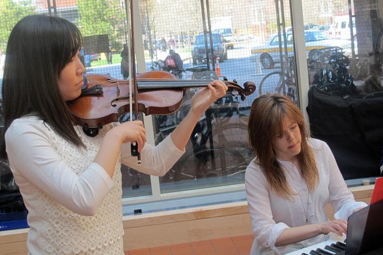 Violniist Hyeryun Cha, CFA '13, performs with pianist Raquel Gorgojo, a graduate student at CFA. (Andrea Shea/WBUR)
