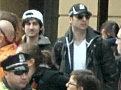 FBI released this image early Friday, April 19, 2013, showing &quot;Suspect 1&quot; in the white cap and &quot;Suspect 2&quot; in the black cap, walking through the crowd in Boston on Monday, April 15, 2013, before the explosions at the Boston Marathon. (FBI/AP)