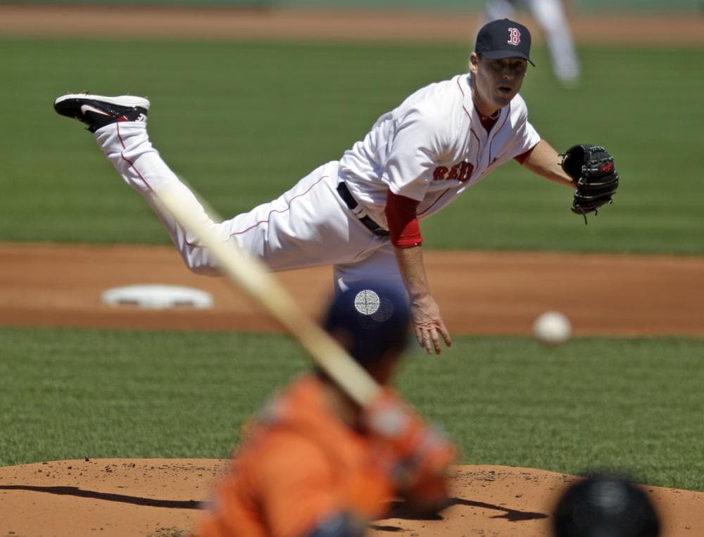 Red Sox starting pitcher John Lackey, top, throws to a Houston Astros batter. (AP/Mary Schwalm)