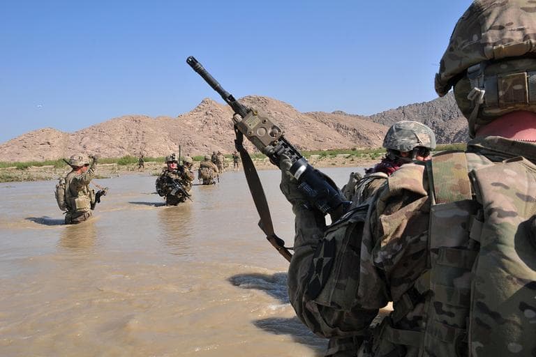 U.S. Soldiers with Charlie Company, 1st Battalion, 38th Infantry Regiment, 4th Brigade Combat Team, 2nd Infantry Division cross the Tarnak river in the Panjwai district of Kandahar province, Afghanistan, April 10, 2013, on a two-day mission to clear the area of explosives caches. The Taliban have announced they will launch their spring offensive on Sunday, April 28, 2013. (Sgt. Kimberly Hackbarth/U.S. Army via AP)
