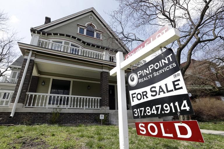 A &quot;Sold&quot; sign is posted outside a home in Indianapolis, Tuesday, April 9, 2013. (Michael Conroy/AP)