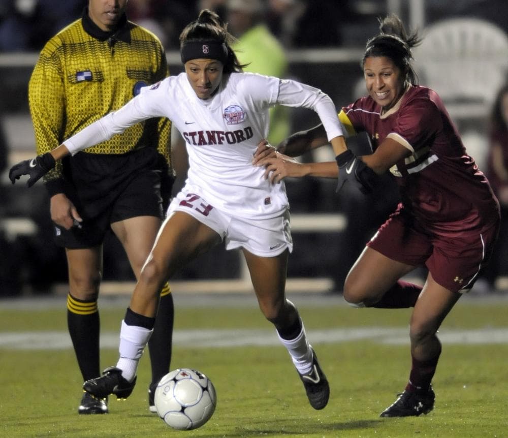 Boston College's Chelsea Regan, right, pulls on Stanford's Christen Press (23) during the semifinals of the NCAA Women's College Cup soccer tournament  in Cary, N.C., Friday, Dec. 3, 2010. Stanford won 2-0 over Boston College. (AP Photo/Sara D. Davis)