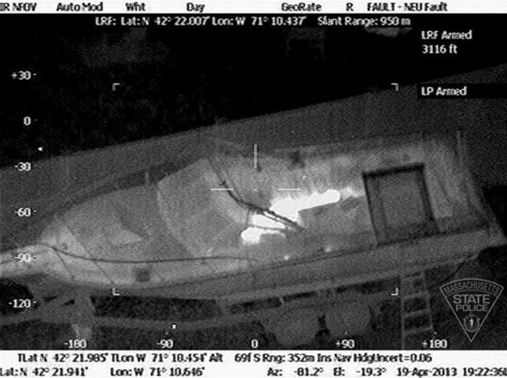 This image made available by the Massachusetts State Police shows 19-year-old Boston Marathon bombing suspect Dzhokhar Tsarnaev hiding inside a boat during a search for him in Watertown. (AP)
