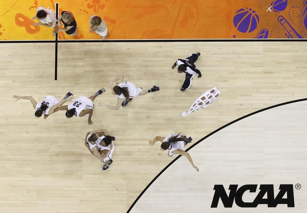 Connecticut players celebrate after defeating Louisville 93-60 in the national championship game of the women's Final Four of the NCAA college basketball tournament, Tuesday, April 9, 2013, in New Orleans. (AP Photo/Gerald Herbert)