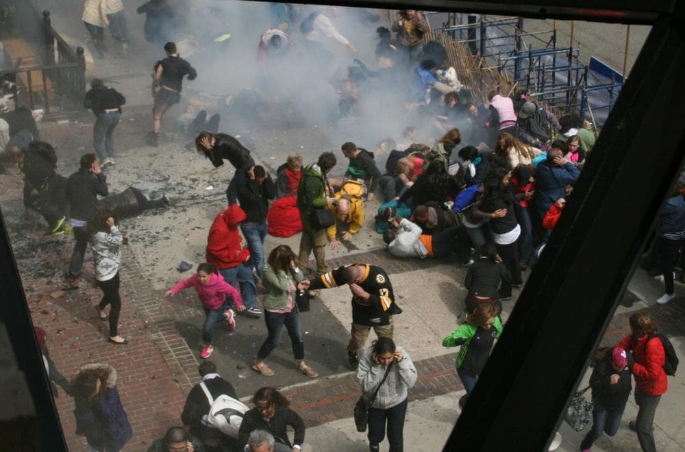 In this image of the scene following an explosion at the Boston Marathon, people can be seen covering their ears. Many people suffered hearing-related injuries in the blasts. (AP Photo/Ben Thorndike)