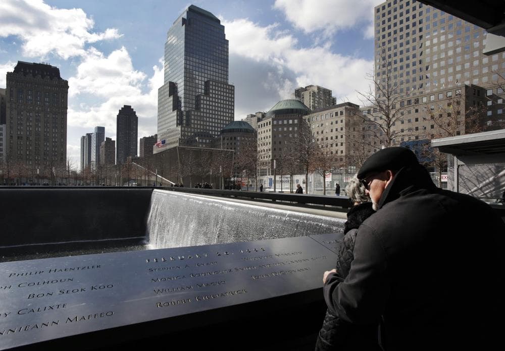 An observer looks at the names engraved in memory of those who died in the terrorist bombing of the World Trade Center, at the National September 11 Memorial and Museum, in New York. (Mark Lennihan/AP)
